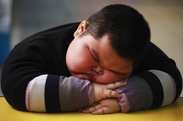 Chins Lu Zhihao, de 4 anos, tem 1,1 metro de altura e pesa 62 quilos