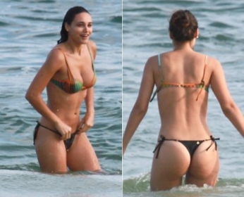 De fio dental, Dbora Nascimento troca beijos com Jos Loreto em praia
